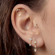 Elara Radiance styled in a layered diamond ear stack