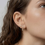 Elara Radiance shown within a layered diamond ear stack