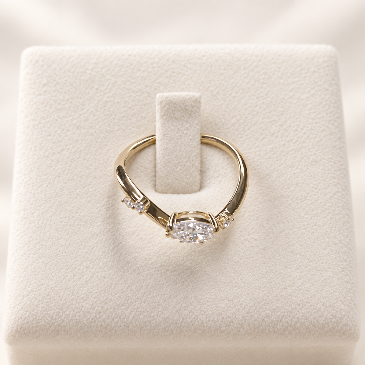 Arden Flame yellow gold pear diamond ring, top and setting view on ivory