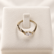 Arden Flame yellow gold pear diamond ring, top and setting view on ivory
