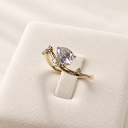 Arden Flame yellow gold pear diamond ring, angled detail on ivory