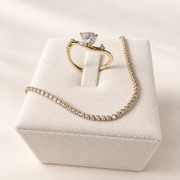 Arden Flame ring styled with the Sola Promise bracelet on ivory; bracelet sold separately