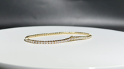 Eira Current tennis bracelet, full line and setting detail on a white turntable