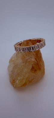 The Dominique 18K yellow gold emerald-cut diamond eternity ring — front view