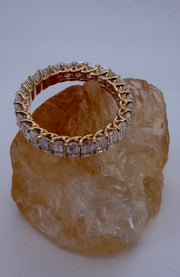 The Dominique 18K yellow gold emerald-cut diamond eternity ring — profile view