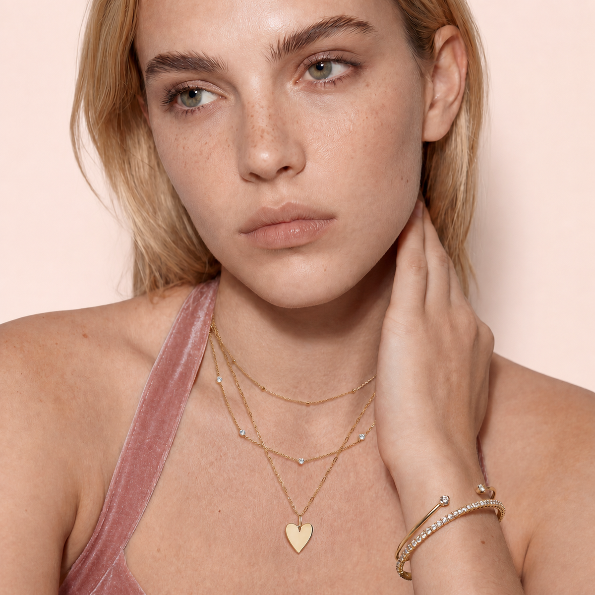 Delia Bloom diamond bracelet styled against a pale blush backdrop