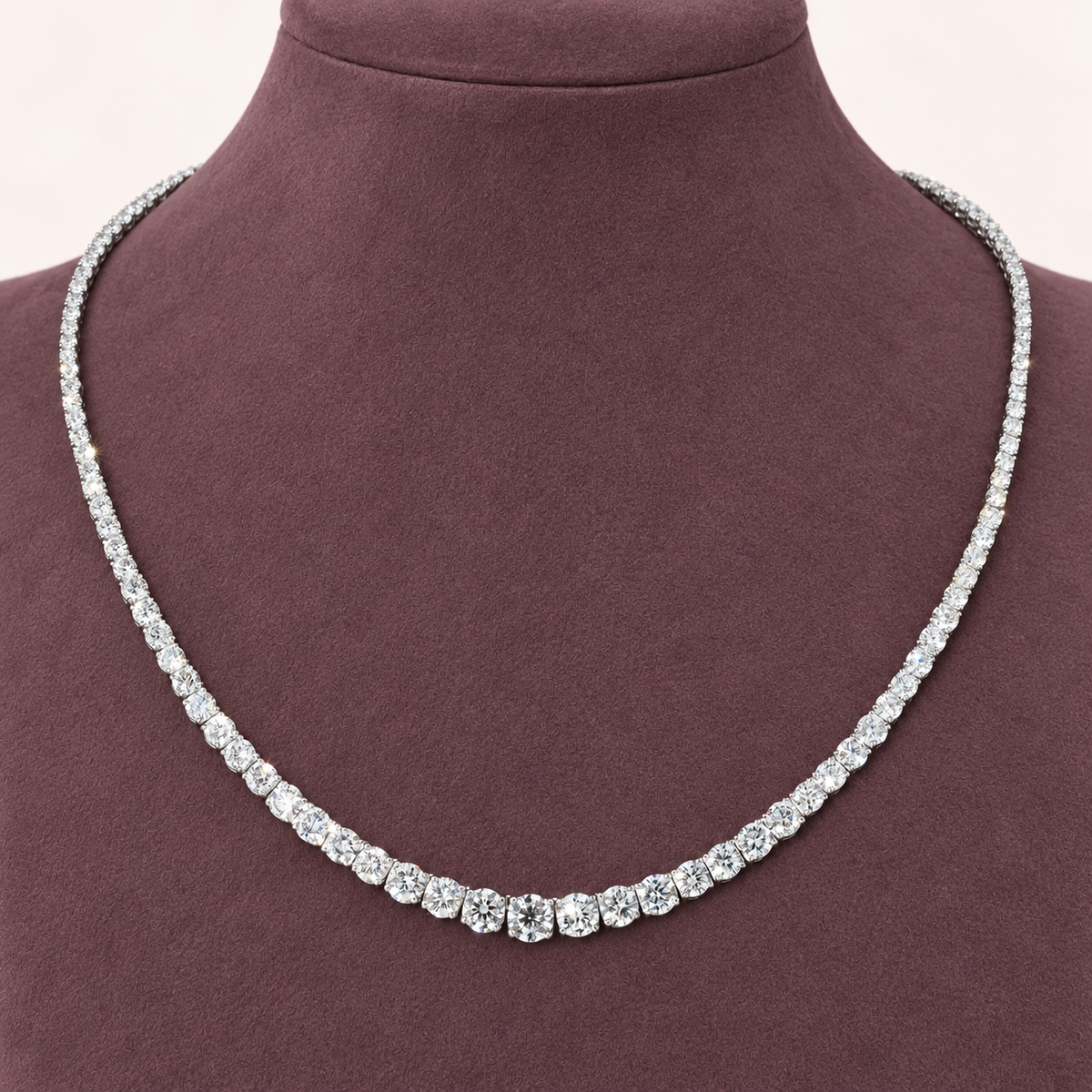 Lenora — Graduated Moissanite Necklace — Closer view on a display bust.
