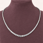 Lenora — Graduated Moissanite Necklace — Closer view on a display bust.