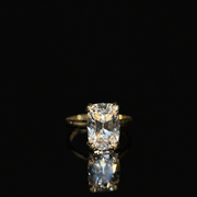 Isolde’s Secret elongated old-mine cushion lab-grown diamond ring, centred front view on polished black Perspex