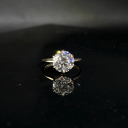 Olivia's Ovation round brilliant lab-grown diamond ring showing natural scintillation on black Perspex