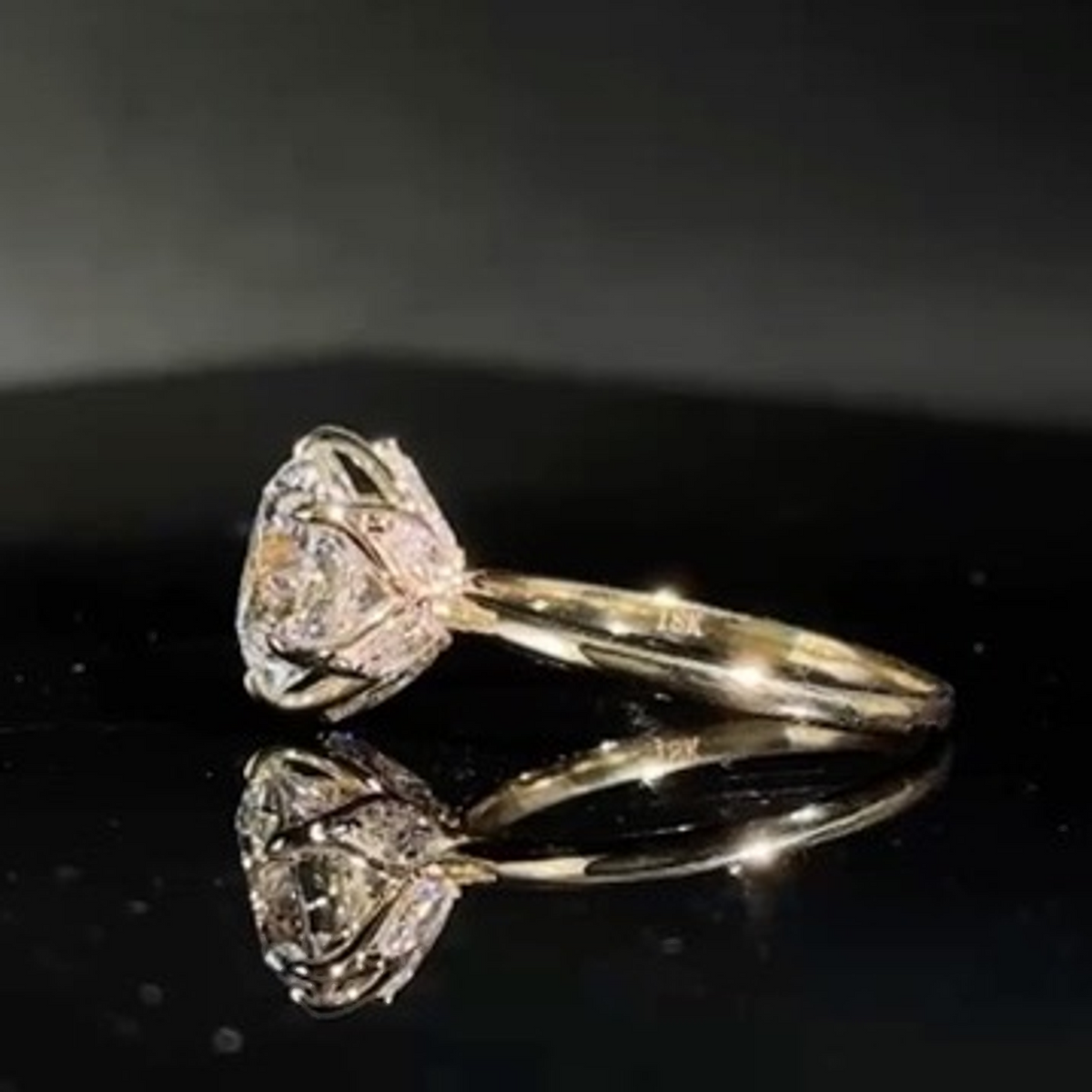 Olivia's Ovation lab-grown diamond ring from the rear, showing its sculptural marquise-set gallery and reflection
