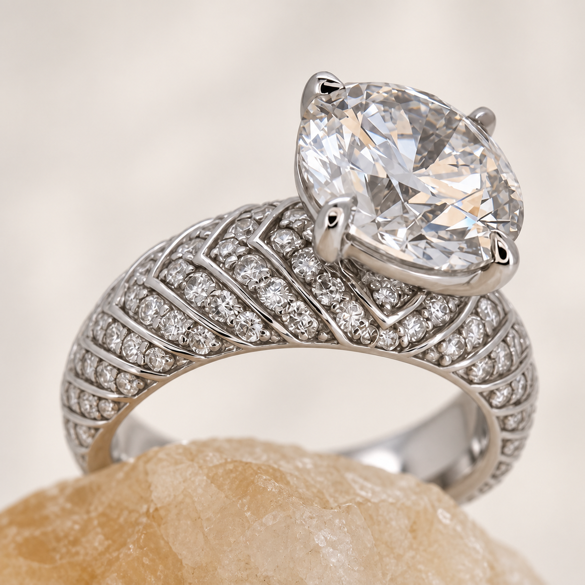 Plume — white-gold pavé shoulder detail on a softly toned crystal