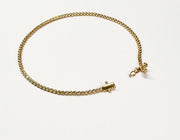 Sola Promise — yellow-gold bezel bracelet rotation and clasp detail on warm ivory