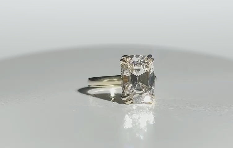 Isolde’s Secret elongated old-mine cushion laboratory-grown diamond ring rotating on softly graded white Perspex