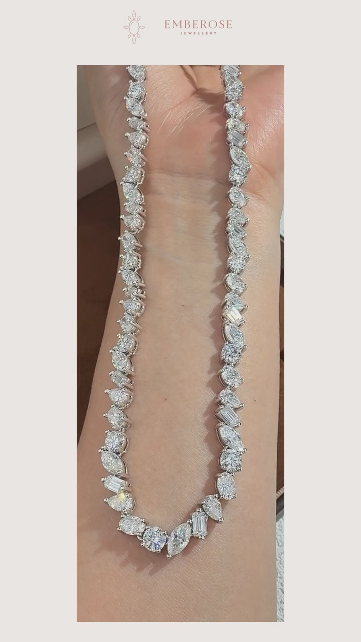 Eveline — Mixed-Shape Moissanite Necklace — original movement detail, muted, with Emberose paper framing.