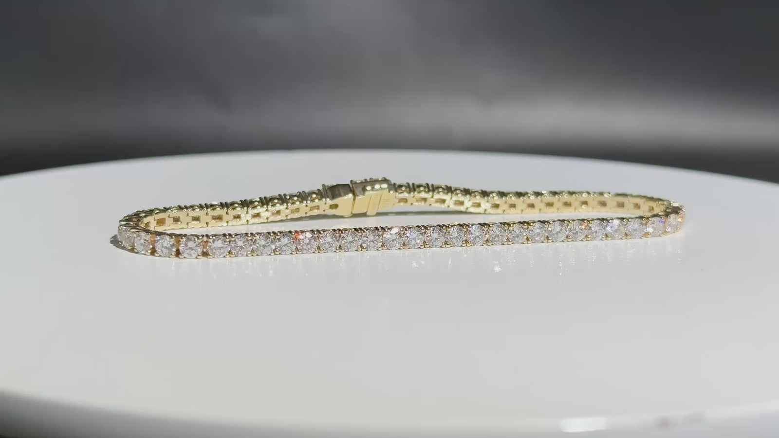 Eira Current tennis bracelet close view on a white turntable