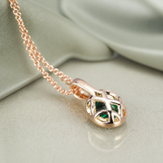 Back view of Verdant Heart pendant on pale sage linen