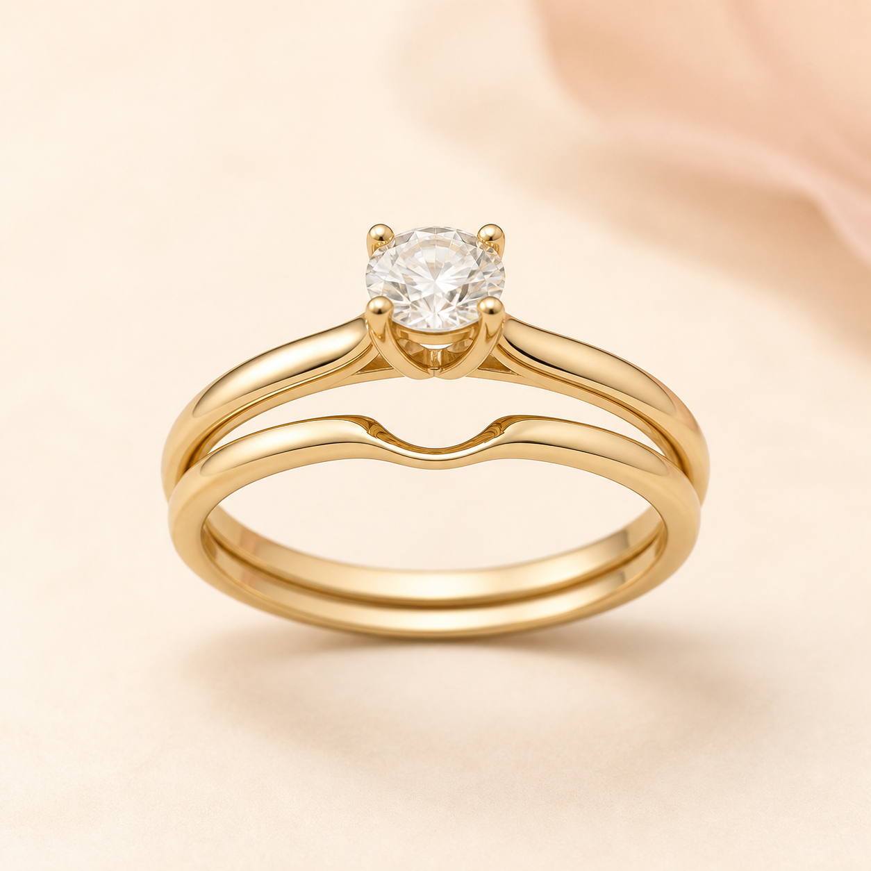 A curved yellow-gold wedding band shaped beneath a solitaire engagement ring